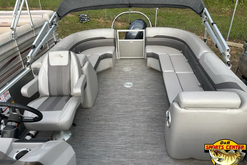 Slide: The Image of 2020 Bennington SX 22 SLX pontoon boat interior with plush seating and steering console. - 7