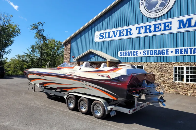 Slide: The Image of 2015 Cobra 260 Venom boat on trailer at Silver Tree Marine facility. - 1