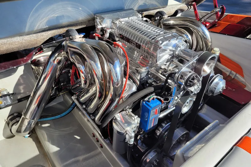 Slide: The Image of High-performance engine of a 2015 Cobra 260 Venom boat, featuring polished chrome components. - 8