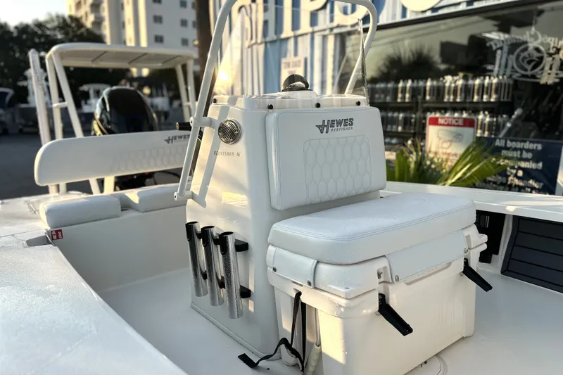 Slide: The Image of 2026 Hewes Redfisher 16 boat interior with seating and rod holders. - 3