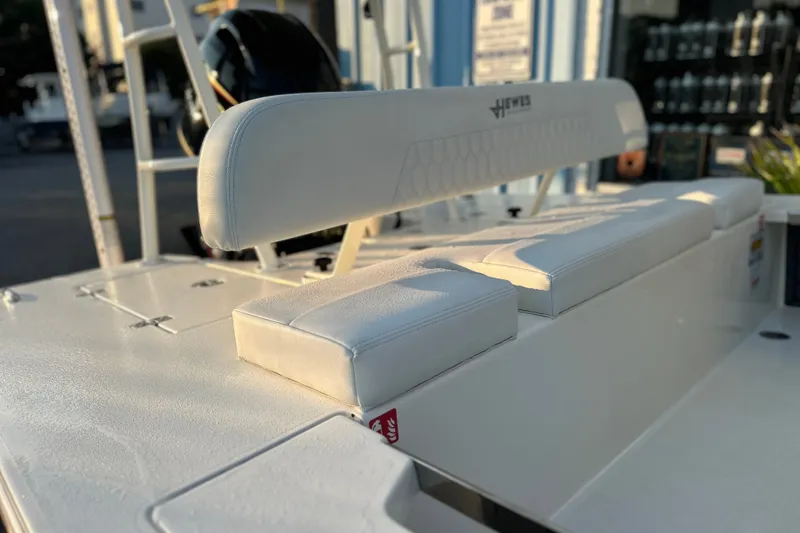 Slide: The Image of 2026 Hewes Redfisher 16 boat interior with white cushioned seating and sleek design. - 5