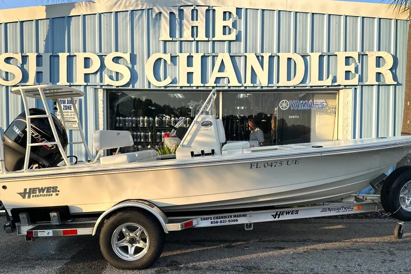 Slide: The Image of 2026 Hewes Redfisher 16 boat on trailer outside The Ships Chandler store. - 8