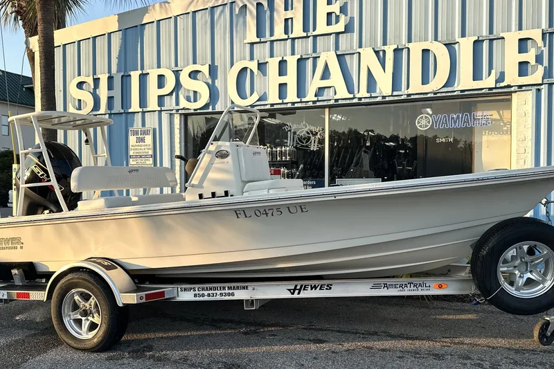 Slide: The Image of 2026 Hewes Redfisher 16 boat on trailer outside The Ships Chandler store. - 9