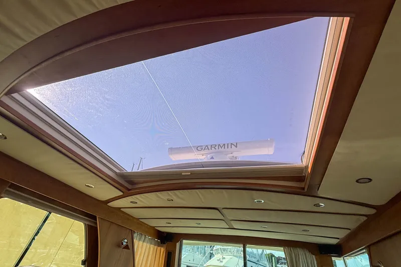 Slide: The Image of Interior view of 2007 Sabre 52 Salon Express with skylight and Garmin equipment. - 66