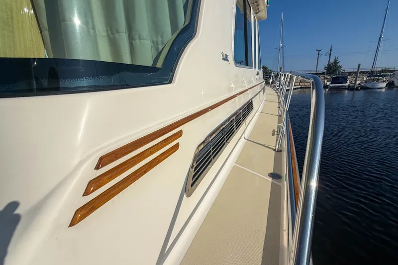 Slide: The Image of 2007 Sabre 52 Salon Express yacht, side view with sleek design and wooden accents. - 49