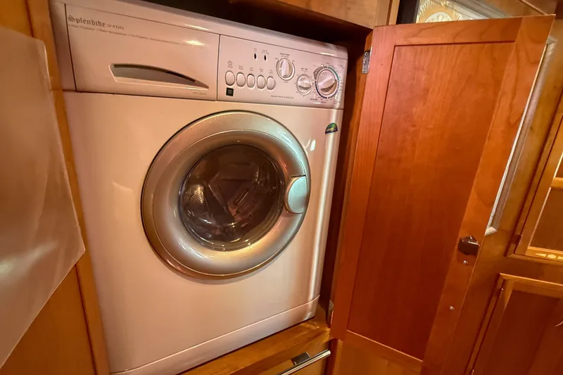 Slide: The Image of Front-loading washing machine in wooden cabinet on 2007 Sabre 52 Salon Express yacht. - 65