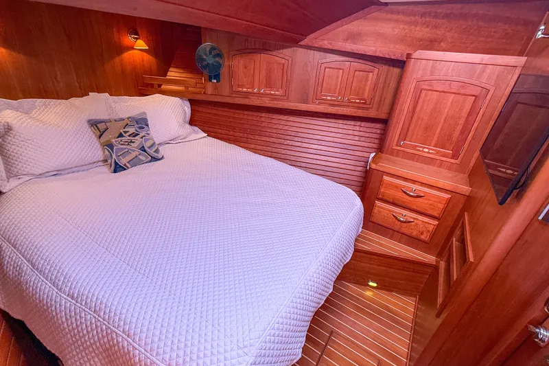 Slide: The Image of Luxurious wood-finished bedroom interior of 2007 Sabre 52 Salon Express yacht. - 40