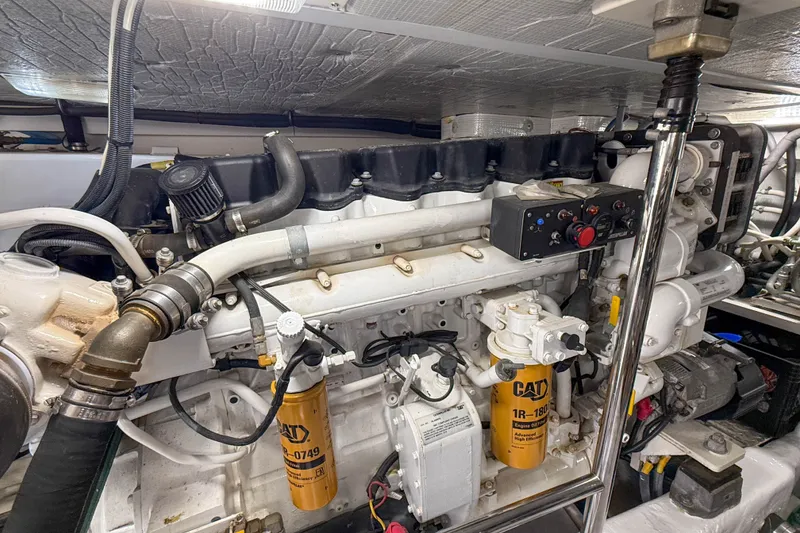 Slide: The Image of Engine room of a 2007 Sabre 52 Salon Express yacht, featuring CAT components. - 60