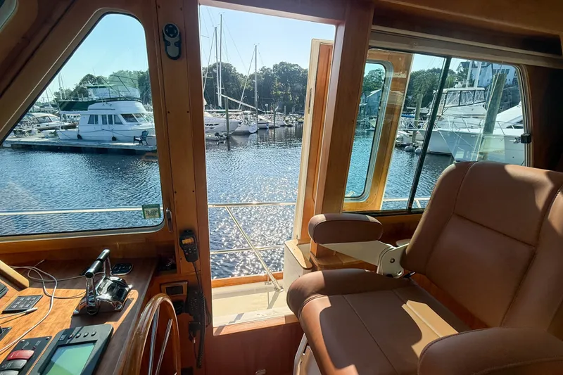 Slide: The Image of Interior view of 2007 Sabre 52 Salon Express yacht, overlooking marina with boats. - 19