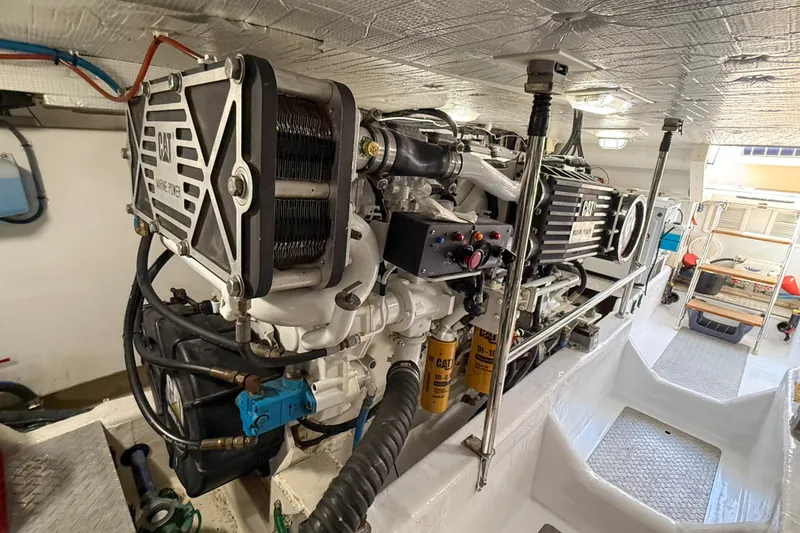 Slide: The Image of Engine room of a 2007 Sabre 52 Salon Express yacht, featuring CAT marine power. - 58