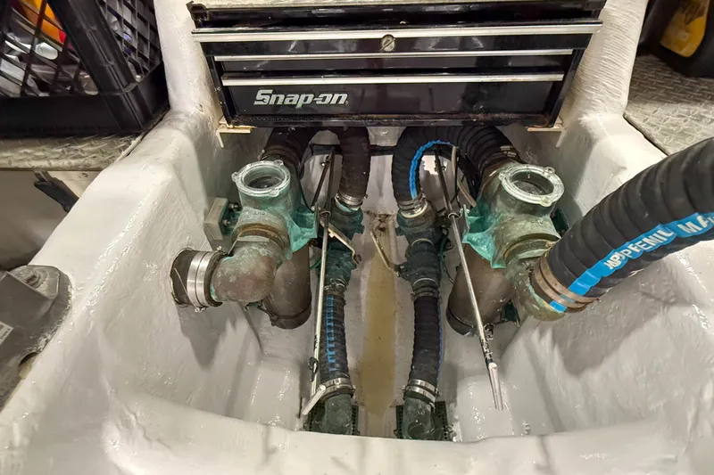 Slide: The Image of Engine compartment of a 2007 Sabre 52 Salon Express with Snap-on toolbox and hoses. - 62