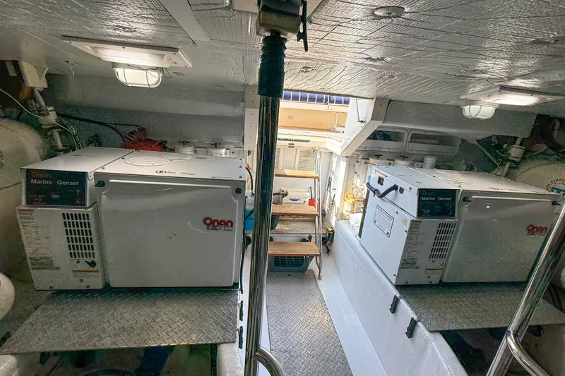 Slide: The Image of Engine room of 2007 Sabre 52 Salon Express with Onan marine generators. - 61