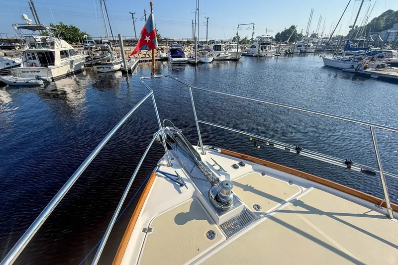 Slide: The Image of Bow view of 2007 Sabre 52 Salon Express yacht docked in a marina. - 52