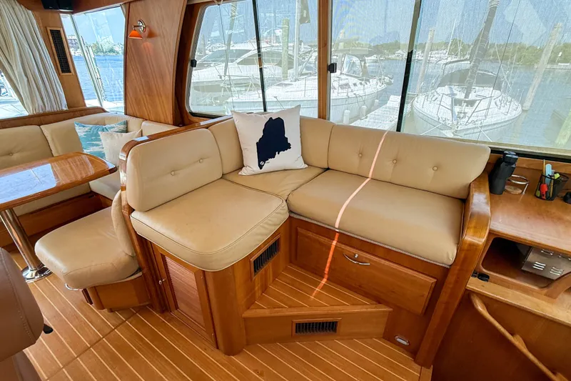 Slide: The Image of Interior of 2007 Sabre 52 Salon Express yacht with beige seating and nautical decor. - 16