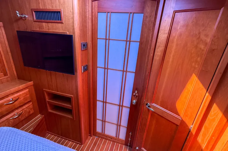 Slide: The Image of Interior of 2007 Sabre 52 Salon Express with wood paneling and frosted glass door. - 41