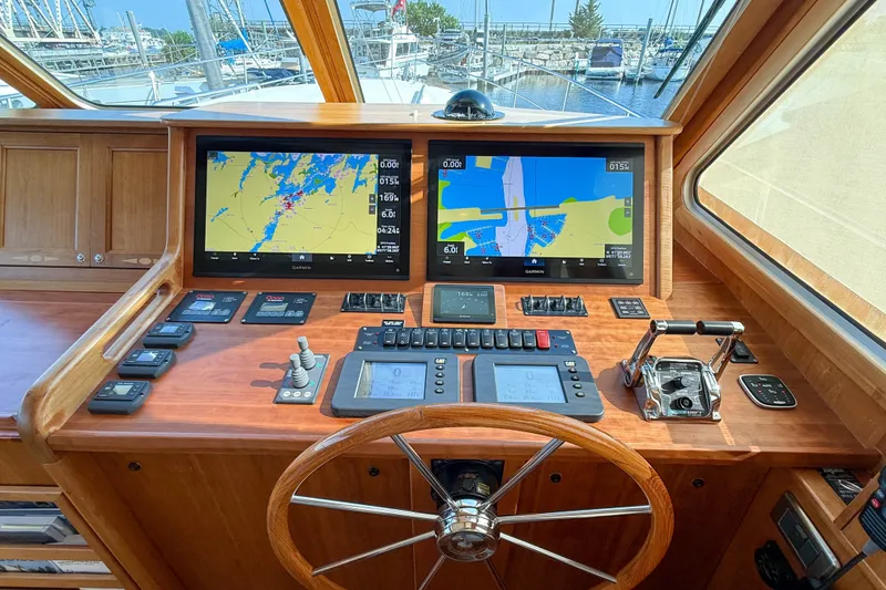 Slide: The Image of Helm of 2007 Sabre 52 Salon Express with navigation screens and controls. - 22