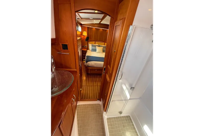 Slide: The Image of Luxurious interior of 2007 Sabre 52 Salon Express yacht with wood finishes and cozy bedroom. - 37
