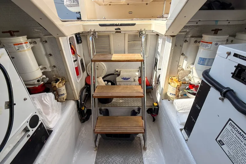 Slide: The Image of Engine room of 2007 Sabre 52 Salon Express with wooden steps and equipment. - 64