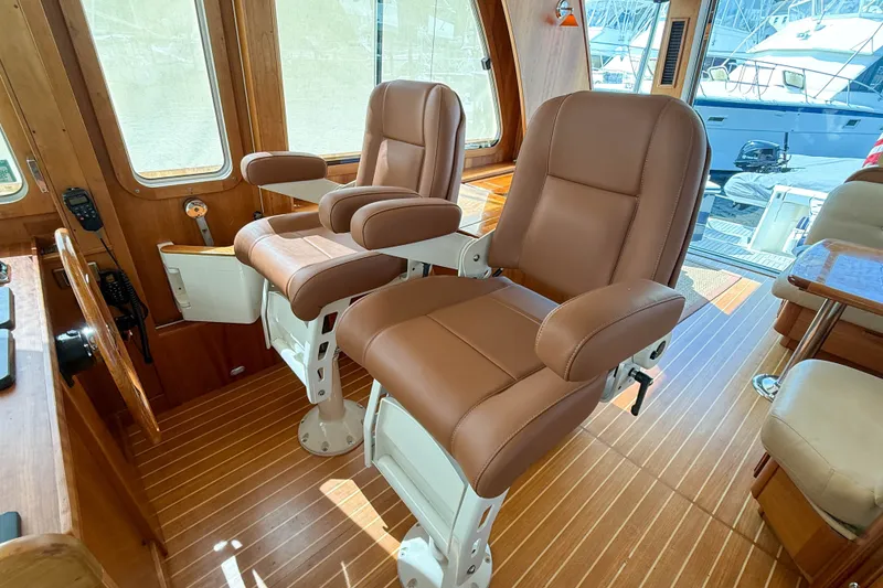 Slide: The Image of Luxurious interior of 2007 Sabre 52 Salon Express yacht with leather seating and wooden flooring. - 18