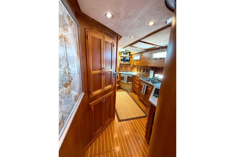 Slide: The Image of Luxurious interior of 2007 Sabre 52 Salon Express yacht with wood cabinetry and modern kitchen. - 44