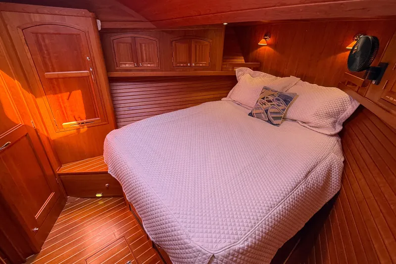 Slide: The Image of Cozy cabin interior of 2007 Sabre 52 Salon Express with wooden paneling and comfortable bedding. - 38