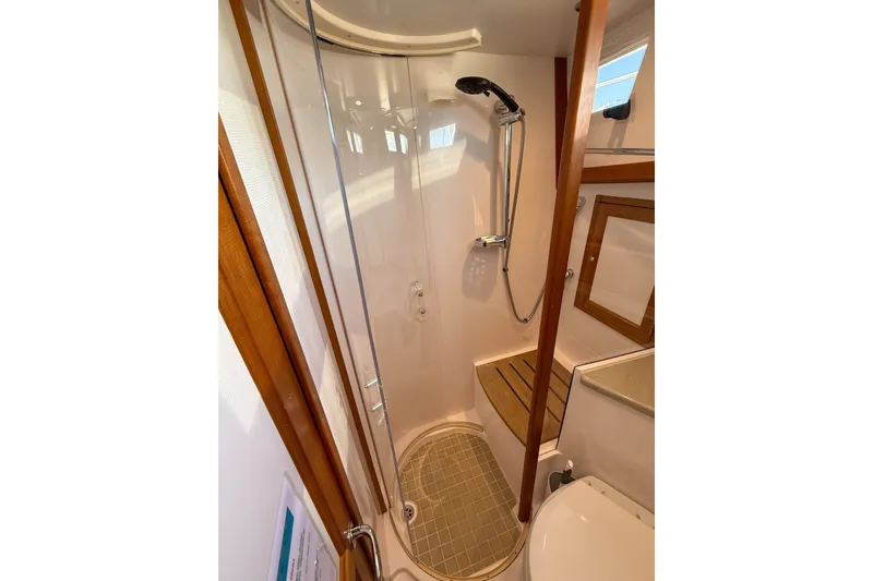 Slide: The Image of Shower area in 2007 Sabre 52 Salon Express yacht, featuring wooden accents and modern fixtures. - 43