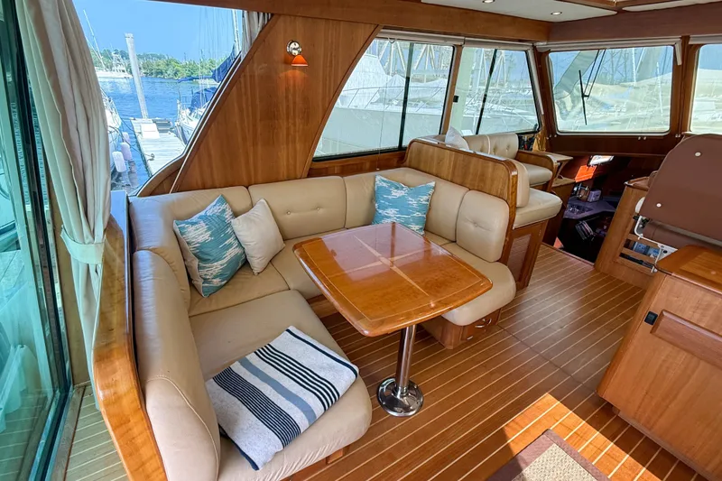 Slide: The Image of Luxurious interior of 2007 Sabre 52 Salon Express yacht with elegant seating and wooden finishes. - 14