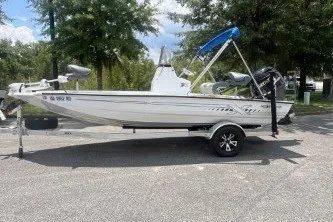 The Image of 2025 Xpress H190B Bay boat on trailer, parked outdoors. - 0