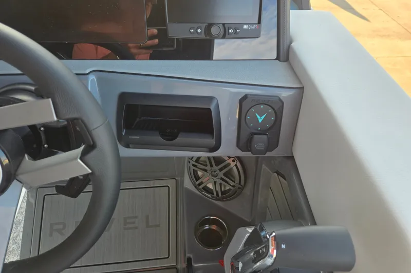 Slide: The Image of Dashboard of 2027 Revel RS25L boat with steering wheel and control panel. - 15