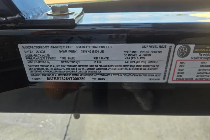 Slide: The Image of Label on 2027 Revel RS25L trailer detailing specifications and safety standards compliance. - 16