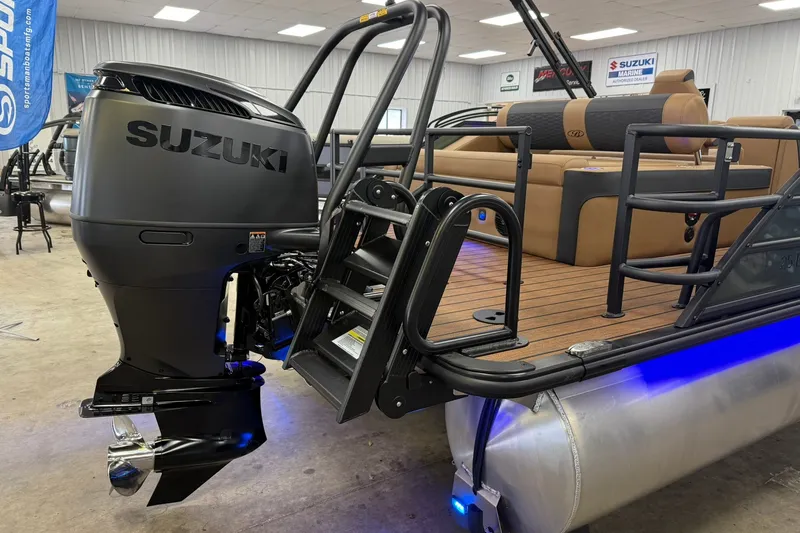 Slide: The Image of 2026 Bentley Pontoons Elite 253 Swingback with Suzuki outboard motor in showroom. - 14