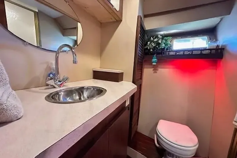 Slide: The Image of Luxurious bathroom in 1981 Ocean Yachts 42 Super Sport with sink and toilet. - 21
