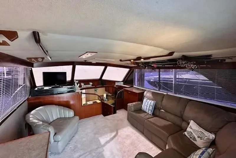 Slide: The Image of Interior of 1981 Ocean Yachts 42 Super Sport with cozy seating and entertainment area. - 13