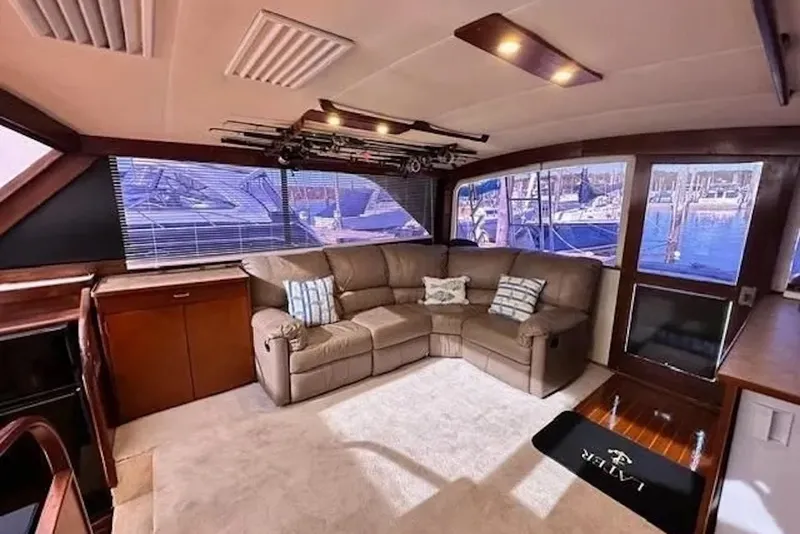Slide: The Image of Luxurious interior of 1981 Ocean Yachts 42 Super Sport with plush seating and large windows. - 14
