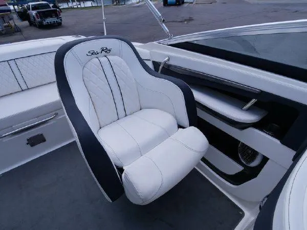 Slide: The Image of A luxurious white captain's chair with Sea Ray logo in a modern boat. - 15