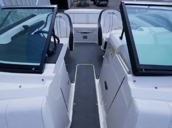 Slide: The Image of The image shows the cockpit of a 2015 Sea Ray 220 Sundeck boat with dual windshields. - 16