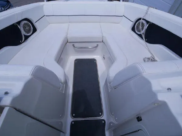 Slide: The Image of The image shows the bow area of a Sea Ray 220 Sundeck boat with white upholstery and speakers. - 17