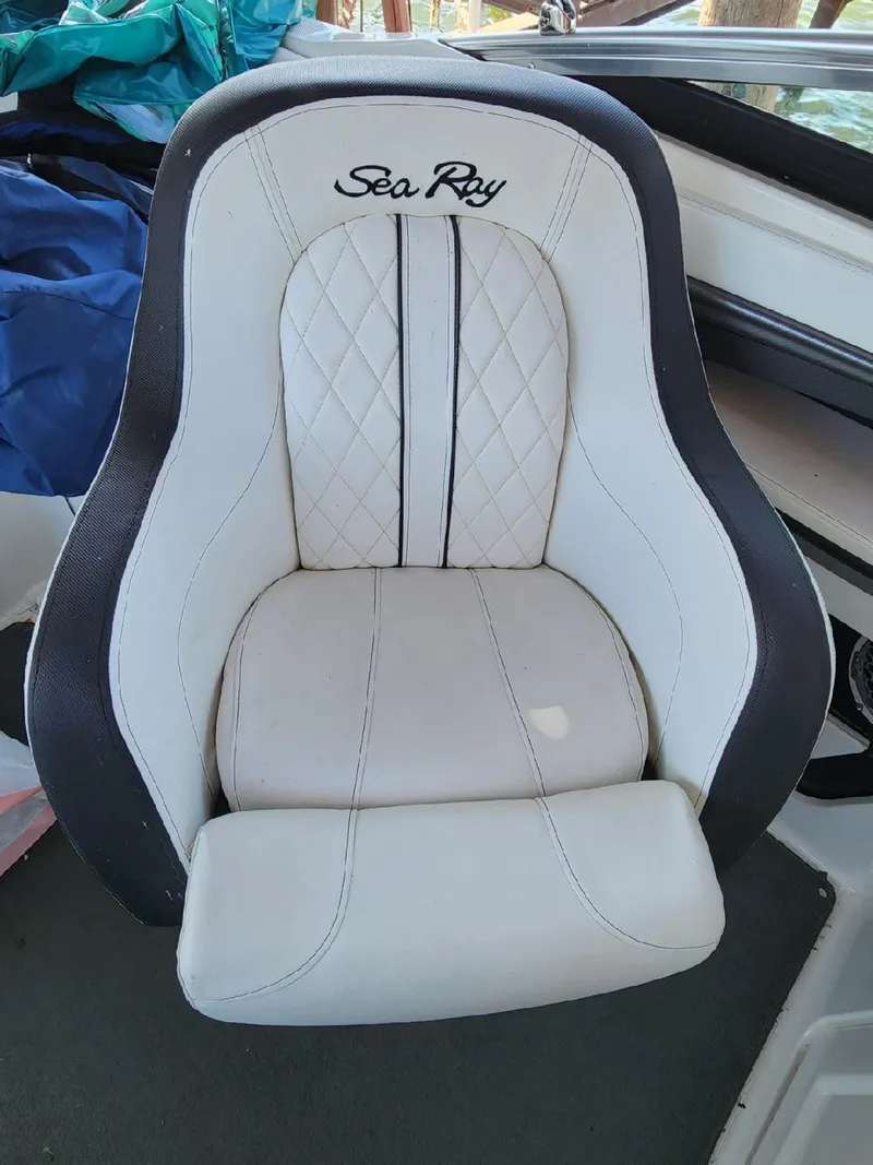 Slide: The Image of A sleek, upholstered seat with Sea Ray logo in a boat. - 28