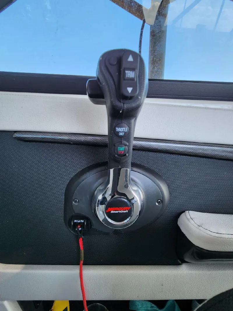 Slide: The Image of Close-up of a throttle lever in a Sea Ray 220 Sundeck boat. - 27