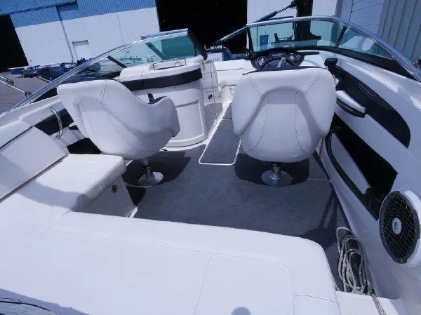Slide: The Image of The image shows the cockpit of a 2015 Sea Ray 220 Sundeck with white seating. - 21