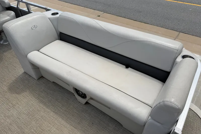 Slide: The Image of 2021 Avalon 2280 Venture Quad Lounger with gray seating and cup holders. - 11