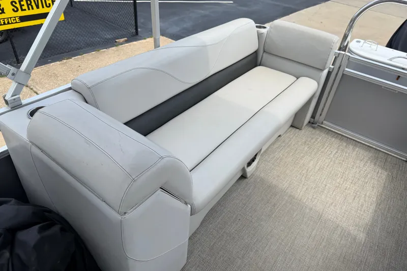 Slide: The Image of 2021 Avalon 2280 Venture Quad Lounger with gray seating and carpeted flooring. - 20