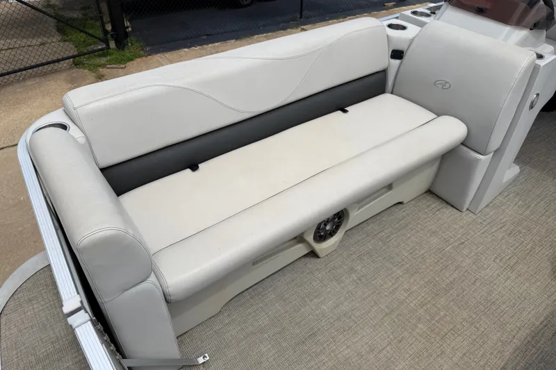 Slide: The Image of 2021 Avalon 2280 Venture Quad Lounger boat seat with beige upholstery and integrated speaker. - 12