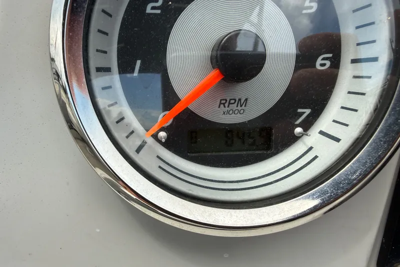Slide: The Image of Close-up of 2021 Avalon 2280 Venture Quad Lounger RPM gauge showing 845.9 hours. - 26