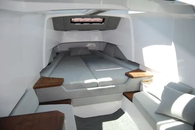 Slide: The Image of Interior cabin of 2022 Axopar 37 XC Cross Cabin, featuring modern design and comfortable seating. - 26
