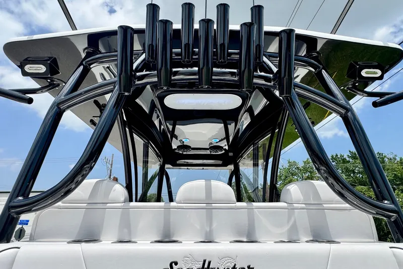 Slide: The Image of 2024 SeaHunter 33 Tournament boat with sleek black frame and rod holders. - 13