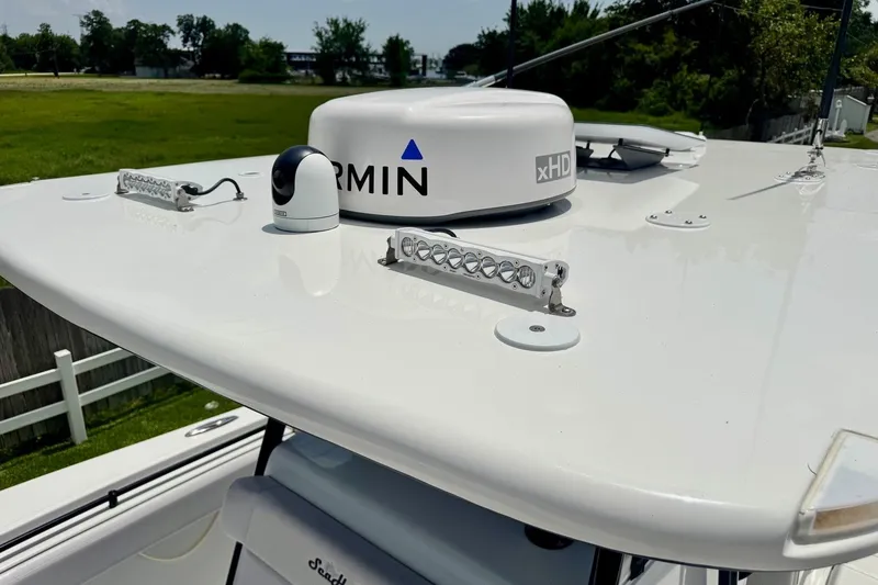 Slide: The Image of 2024 SeaHunter 33 Tournament boat with Garmin xHD radar on the roof. - 22