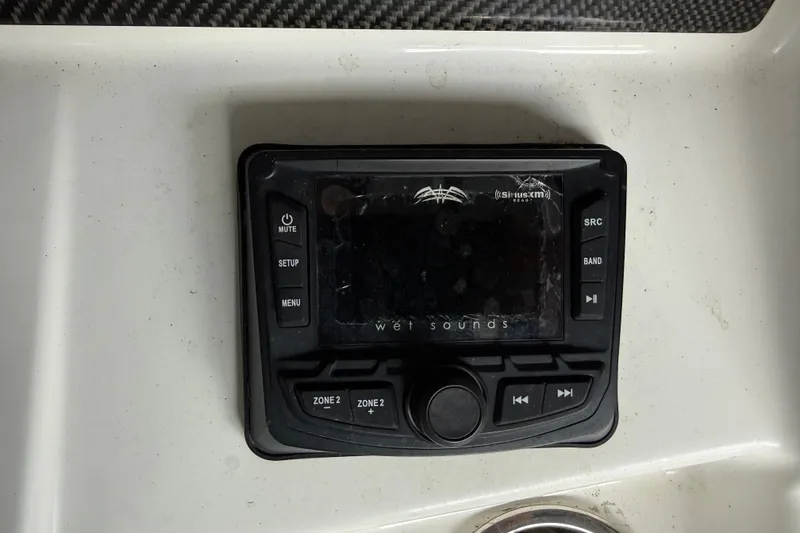 Slide: The Image of Wet Sounds audio control panel on a 2021 Sea Cat 260 boat dashboard. - 20