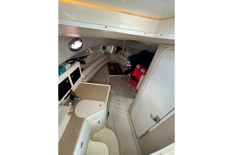 Slide: The Image of 2004 Hydra-Sports Vector 2800 WA cabin interior with kitchenette and storage. - 20