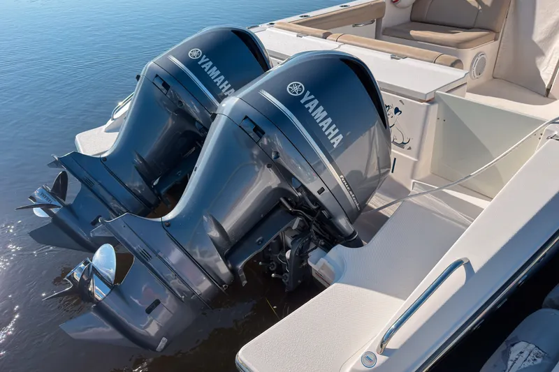 Slide: The Image of 2015 Pursuit DC 325 Dual Console with twin Yamaha outboard engines. - 15